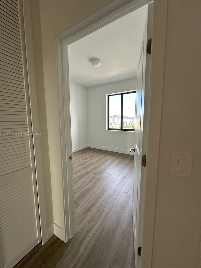 hallway featuring hardwood / wood-style flooring