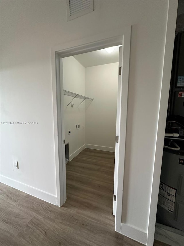 laundry room featuring dark wood-type flooring and hookup for a washing machine