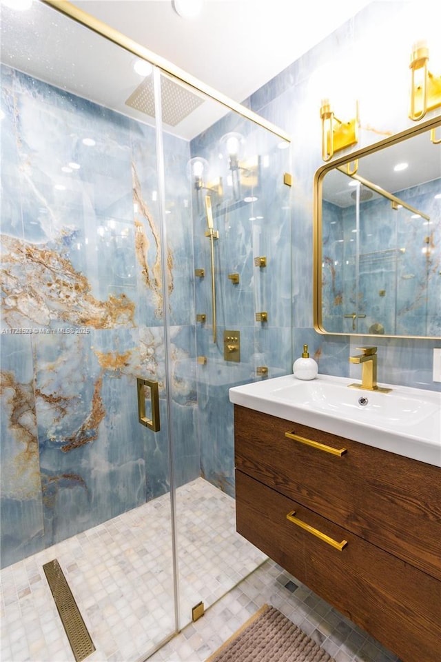 bathroom featuring vanity and an enclosed shower