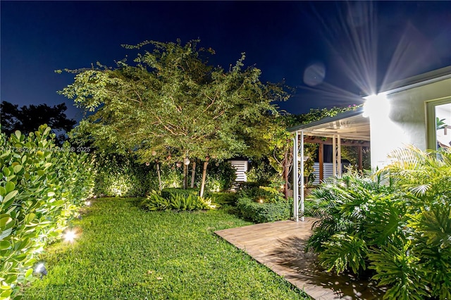 view of yard at twilight