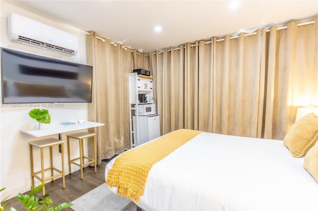 bedroom featuring an AC wall unit and wood-type flooring