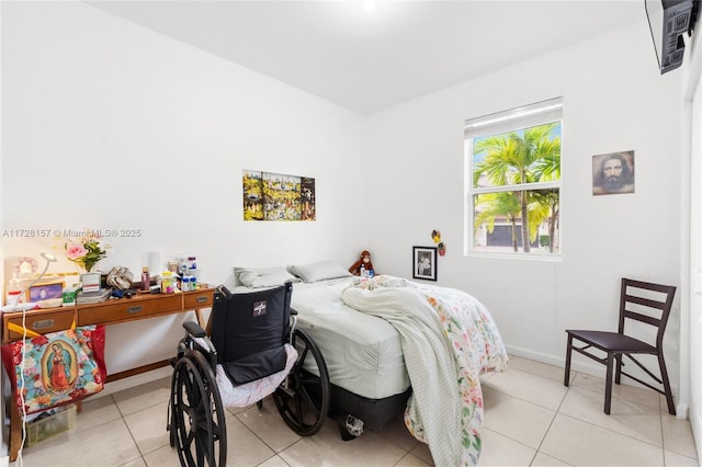 bedroom with light tile patterned floors