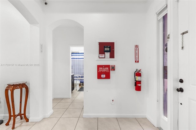 hallway featuring light tile patterned floors