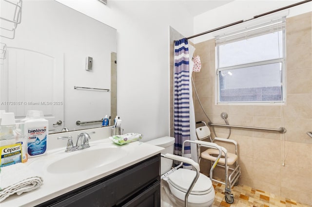 bathroom with toilet, vanity, and a shower with curtain