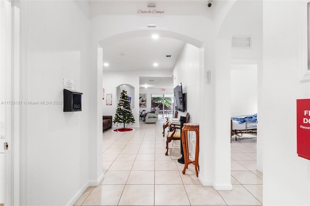 corridor with light tile patterned floors