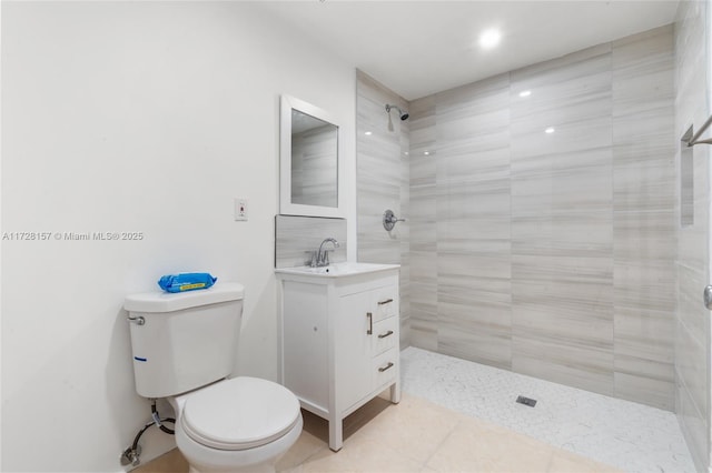 bathroom with toilet, walk in shower, and vanity