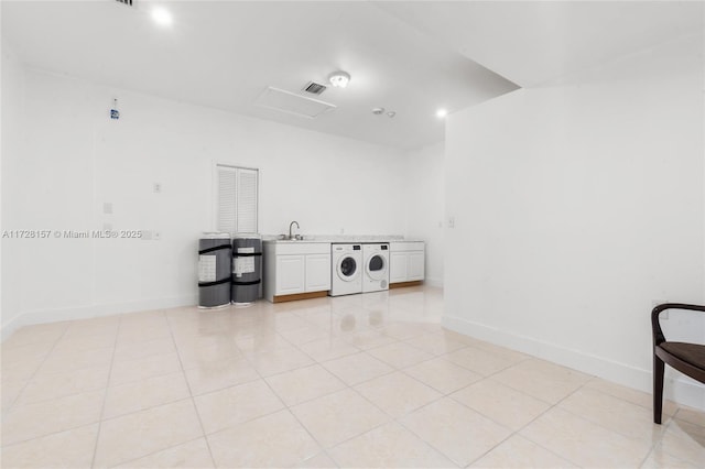 laundry room with sink, light tile patterned floors, and washer / clothes dryer