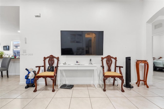 living area featuring light tile patterned floors