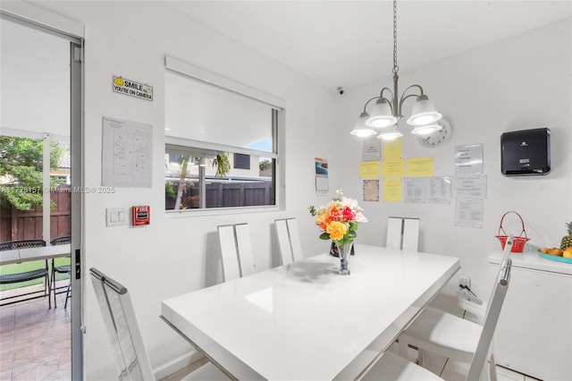 dining space with a chandelier