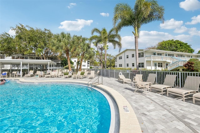 view of swimming pool featuring a patio area