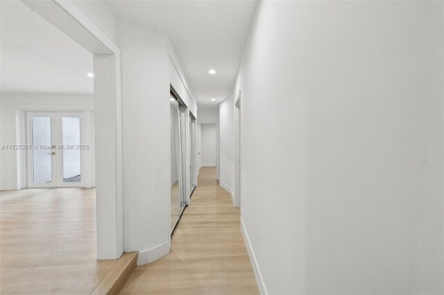 299 S Biscayne River Dr, Miami, FL 33169 - hallway featuring light wood-style floors, recessed lighting, baseboards, and french doors