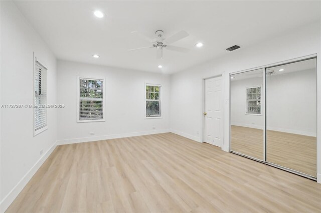 299 S Biscayne River Dr, Miami, FL 33169 - unfurnished bedroom featuring recessed lighting, light wood-style floors, baseboards, a ceiling fan, and a closet
