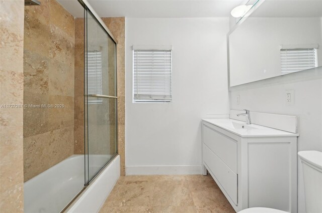 299 S Biscayne River Dr, Miami, FL 33169 - full bath featuring toilet, vanity, baseboards, and bath / shower combo with glass door