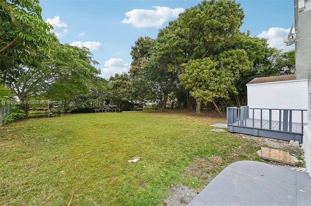 view of yard with a deck