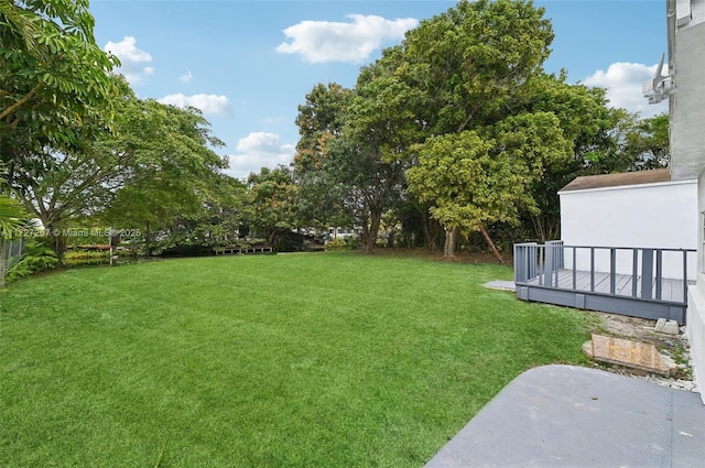 view of yard with a wooden deck