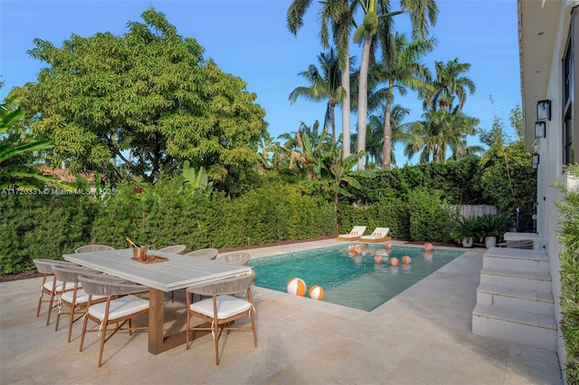 view of swimming pool with a patio area