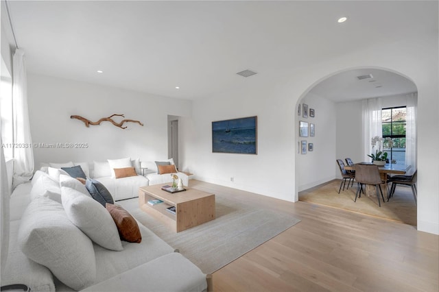 living room with light hardwood / wood-style flooring