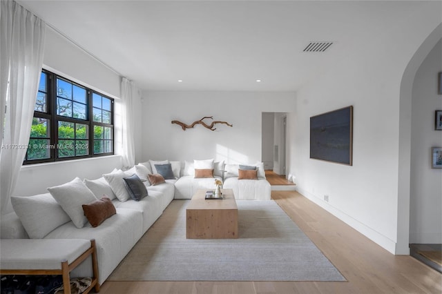 living room with light hardwood / wood-style floors