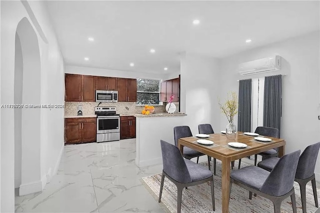 dining room with recessed lighting, an AC wall unit, marble finish floor, and baseboards