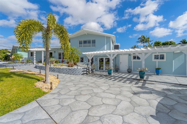 2518 Tortugas Ln, Fort Lauderdale, FL 33312 - back of house featuring a lawn