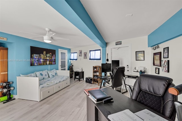 office featuring light hardwood / wood-style floors and ceiling fan