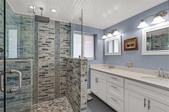 bathroom featuring vanity, a shower with door, and wooden ceiling