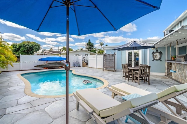 view of swimming pool with a patio area