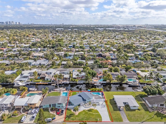 birds eye view of property featuring a water view