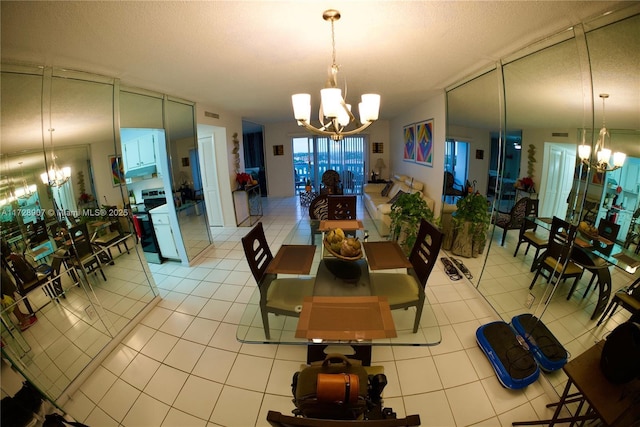 tiled dining room with an inviting chandelier