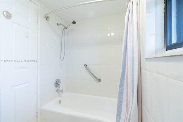 bathroom with shower / bath combination with curtain