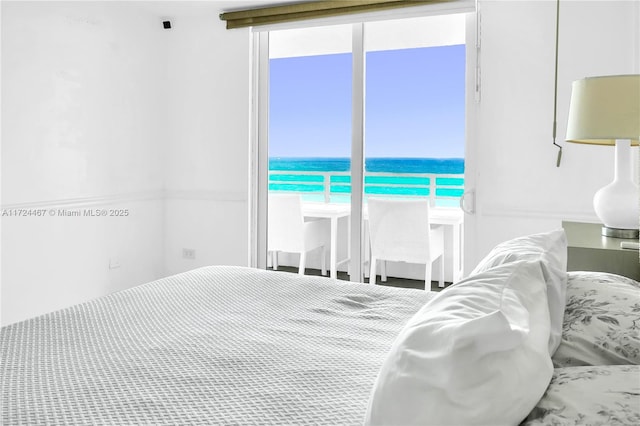 bedroom featuring a water view