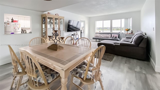 dining space featuring light hardwood / wood-style floors