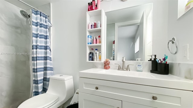 bathroom featuring toilet, vanity, and a shower with shower curtain