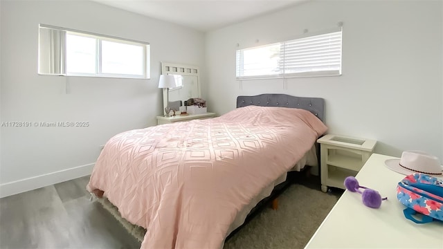 bedroom with hardwood / wood-style floors