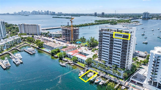 birds eye view of property with a water view