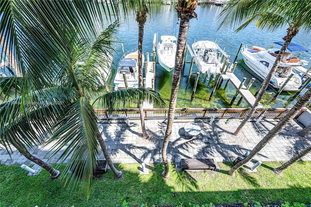 exterior space with a water view and a boat dock