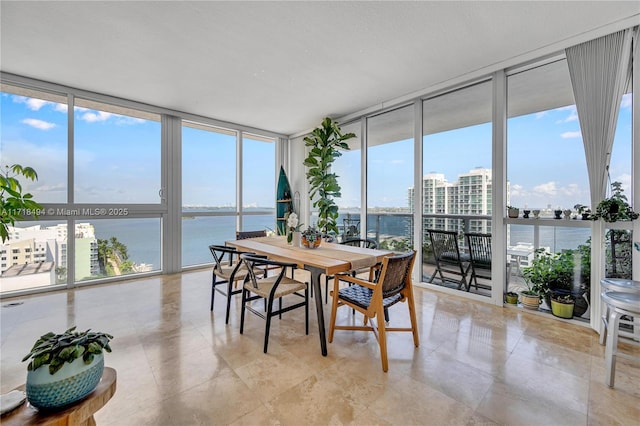 sunroom with a water view