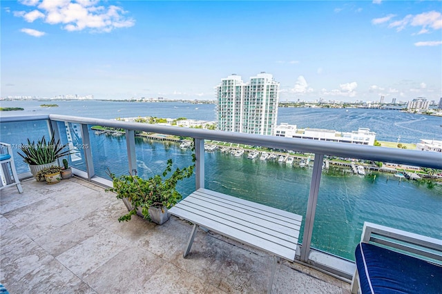 balcony featuring a water view