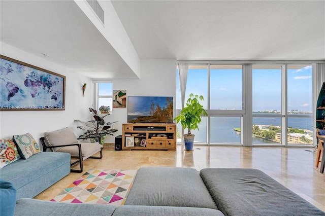 living room with a healthy amount of sunlight and expansive windows