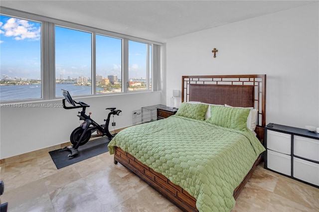 bedroom featuring a water view