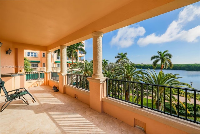 balcony featuring a water view