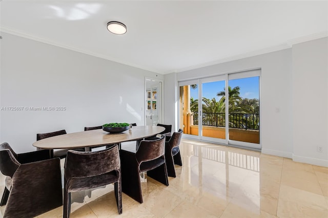 dining room featuring ornamental molding