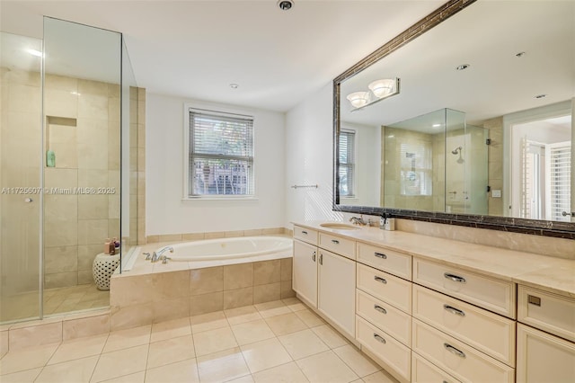 bathroom featuring independent shower and bath, tile patterned floors, and vanity