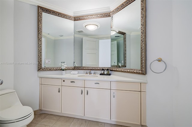 bathroom with tile patterned floors, toilet, vanity, and ornamental molding