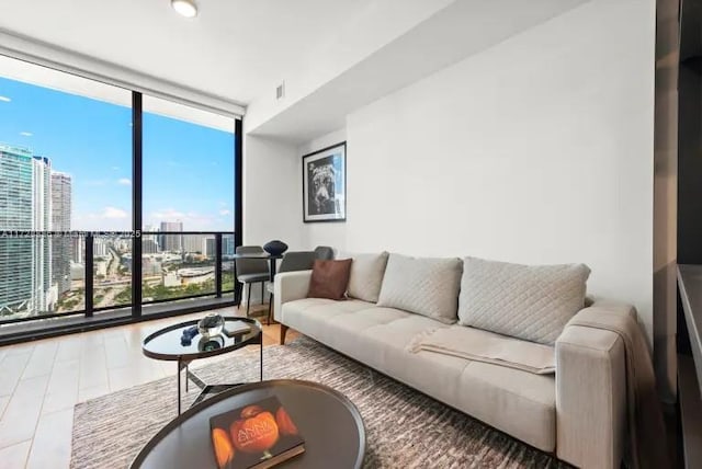 living room featuring floor to ceiling windows