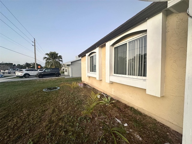 view of side of home featuring a yard