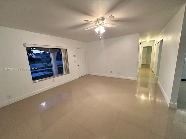 2165 SE Floresta Dr, Port St Lucie, FL 34984 - unfurnished room featuring light tile patterned flooring, a ceiling fan, and baseboards