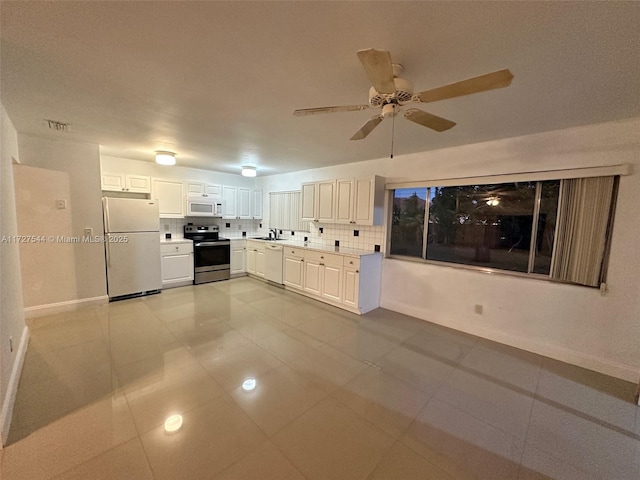 kitchen featuring tasteful backsplash, ceiling fan, light tile patterned floors, white appliances, and white cabinets