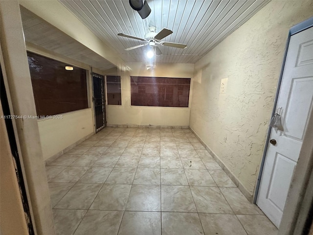 spare room with wooden ceiling and ceiling fan