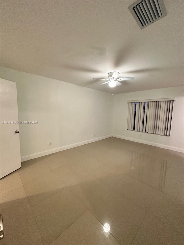 2165 SE Floresta Dr, Port St Lucie, FL 34984 - spare room featuring baseboards, a ceiling fan, and tile patterned flooring